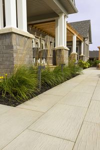 This walkway design is inspired by our Ocean Grande patio slab. The Ocean texture is a first of its kind and was inspired by the veins left behind on sandy ocean shores. Check out our website to shop the look! Or, check out the estimation tool on our website to get an idea of how much a similar project could cost you!