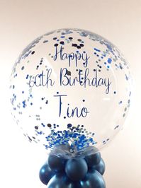 Table centrepiece bubble balloon filled with blue confetti and personalised with blue text. These beautiful balloons are ideal for using as table decorations for all occasions. For more information please visit our website... Balloon delivery throughout the UK! #balloonsbycelebrations #balloongift #balloondecorations #partyballoons #balloonsdelivereduk #balloondeliveryuk #personalisedballoons #birthdayballoons #ballooninabox