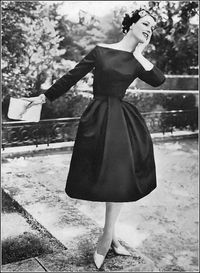 Betsy Pickering in black satin cocktail dress with bell skirt and straight across neckline by Nina Ricci for Vogue Pattern 1388, photo by Roger Prigent, Vogue, November 15, 1957
