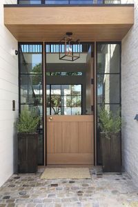 Modern with a Twist | We’re head over heels for these divided doors. You’ve heard that the eyes are the windows to the soul. Well, in that sense, doors are the windows to the soul of the home. (Yes, we know your home has actual windows too…just stick with us.) Your front door welcomes guests for the first time, gives personality at a glance from the street, and can be the ultimate conversation-starter if given the chance. Your mudroom door herds in a gaggle of children, wrangles in your beloved