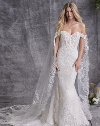 A garden-inspired lace bridal gown with style and sophistication to spare! Harlem Lane is the epitome of perfection, and will bring ALL of the dark fairytale wedding vibes! Click through for all the deets! #darkfairytaleweddingdress #fairytalewedding #gardeninspiredbridalgown #lacebridaldress