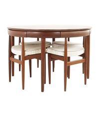Hans Olsen for Frem Rojle Mid Century Teak Dining Table with Nesting Chairs - Set of 4The table measures: 47 wide x 47 deep x 29.25 high, with a chair clearance of 26.5 inches; the leaf is 20 inches wide, making a maximum table width of 67 inches when the leaf is usedThe chairs measure: 18.5 wide x 16 deep x 28.25 high, with a seat height of 19 inches