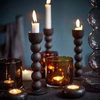 Use a mix of candle stands and votives to create a soft mood. Image courtesy, IKEA