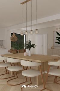 Un espace repas dans la pièce de vie avec une grande table minimaliste et chaises tendances. Découvrez le book complet de ce projet réalisé par notre décoratrice Angèle ici ! #deco #decoration #salon #piecedevie #épuré #contemporain #tendance