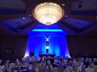 Royal Blue Bling Ceremony #wedding #reception #bling #royalblue #lethbridgeeventrentals #lethbridgeevents #decor #catering #ceremony #backdrop #chandelier #tieredheadtable #beadedcurtain