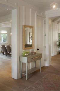 Organic modern home - all white board and batten interior walls, enrtyway; glass globe fixture -----