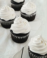 Caramel-filled moist chocolate cupcakes topped with a mountain of marshmallow frosting. Plus an awesome #HTCOne + personal chef #giveaway!