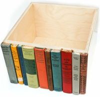 Old book spines glued to a box. Hidden storage, sneaky.