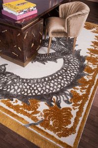 The golden REDLEH RUG is an attractive element that elevates a room's décor. Because of the varying lengths of the rug's wool threads, this patterned rug has outstanding intricacy and a three-dimensional look.