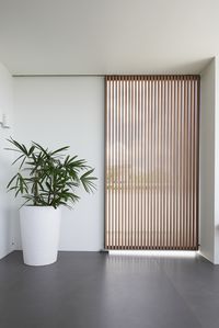 Ever Art Wood Kabebari battens by Covet - a wood screen sliding door is a highly desirable look, but real timber can pose challenges due to its weight. The weight of solid timber on a door track greatly increases the wear, leading to premature degradation and early replacement. In these circumstances aluminium is an excellent choice as it has a very high strength to weight ratio, meaning it will not cause excessive wear on sliding door tracks - and it will provide a degree of added security.
