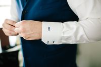 Blue monogram on a shirt cuff to add a pop of colour