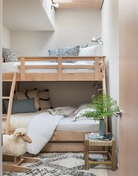 Custom bunk room + bunk beds + light wood bunk bed with ladder + patterned shag rug + minimalist kids bedroom | Ore Studios