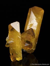 Baryte, Pohla, Schwarzenberg District, Erzgebirge, Saxony, Germany, miniature, 3.9 x 3.8 x 2.5 cm, This superb miniature features a pair of gorgeous translucent to gemmy, amber barytes, one measuring 4 cm and the other 3.4 cm in length with the smaller one being doubly-terminated., For sale from The Arkenstone, www.iRocks.com. For more details on this piece and others, visit https://www.irocks.com/minerals/specimen/46902
