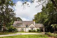 ASHLEY GILBREATH INTERIOR DESIGN: An Alabama designer literally blew the roof off this home renovation. Taking a former ranch style home and adding a second story was just what this home that overlooks the greens needed. A traditional southern home with white brick exterior, cedar shake roof, and custom shutters and door.