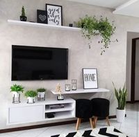 Sala de tv parede com cimento queimado