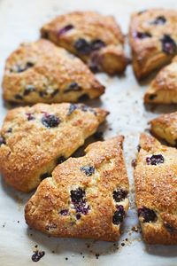 Blueberry Scones that taste fresh from the bakery! Juicy blueberries, crunchy turbinado sugar, and perfect browned for breakfast or brunch. #sconerecipe #yummy #recipe #breakfast | pinchofyum.com