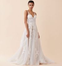 Boho and romantic tulle aline wedding dress with beaded lace appliques, V neckline, illusion bodice and long train. Available to try on in store in size 14. #MissRubyBride Milwaukee, Wi