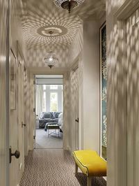 Palmer Weiss - bedrooms - hallway, hall, pierced lanterns, pierced metal lanterns, yellow bench, velvet bench, yellow velvet bench, greek ke...