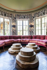 With looks that are somewhere between English country home and Soho House, this grand hotel is playful rather than formal. Rich hues of teal, turquoise and plum complement painterly House of Hackney wallpaper, while layers of Neisha Crosland fabrics in earthy tones and folds of herringbone or velvet pose alongside bulging bookcases and glass-fronted fireplaces.