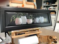 Marie Wheeler Art on Instagram: “WIP - A large black door panel with a display of greenery pottery. You see my little buddy watching over me. My rescue Dakota hangs with me…”