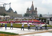 Live flowers are being arranged near the Kremlin wall opposite the central entrance to the Main Department Store (GUM) in Moscow.