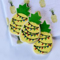 Trying to think of new Christmas cookie ideas? Learn how to ice a tropical pineapple Christmas cookie. This is sure to be a showstopper at a party or cookie exchange.