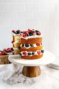 This Lemon Berry Layer Cake has layers of moist lemon cake, fresh berries and fluffy buttercream frosting! It’s light, fruity and perfect for spring!