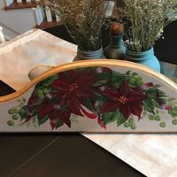 I found this stashed away. A door crown I painted 12 Year’s ago. I was thinking of it because my daughter asked if I’ve ever painted poinsettias. #brushstrokesbymarie #treasuresupcycled #farmhousedecor #farmhousestyle #whimsical #poinsettia #christmastime #christmasdecor