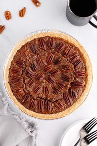 This amazing pecan pie recipe makes the best pecan pie you’ve ever tasted. Rich, gooey, and sweet, with a world-class homemade pie filling and lots of fresh pecans. It makes the holidays delicious! #homemade #pecans #dessert #pie #autumn