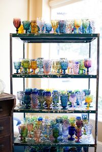 Southern Vintage rental colored stemware and industrial shelves rental