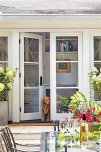The Patio Doors Open Up the Exterior - A Dramatic Ranch House Renovation - Southernliving. "Ranches tend to have 8-foot ceilings and not a lot of natural light, making them feel cramped," Evans notes. Three new sets of 7-foot-tall French doors significantly brighten up the interior rooms surrounding the patio and allow people to move indoors and outdoors much more easily.