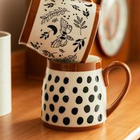 The Fay Retro Mug is inspired by vintage designs with a unique shape and designs. The mug's shape is oversized to hold extra of your favorite beverage and features a curved design that fits effortlessly in your hand. The Fay collection makes for a great gift for fellow coffee lovers, or a beautiful set to display on kitchen shelves. Details Glazed ceramic Non-slip bottom Dishwasher + Microwave Safe 17 oz capacity Whether you're drinking your morning coffee or evening tea - this retro Sage & Sill