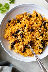 This quick and easy recipe for Black Beans and Rice is delicious! Made with sofrito, canned black beans and long-grain rice.