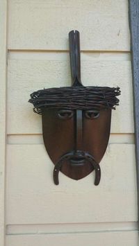 Metal sculpture shovel face