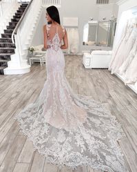 Sexy Lace Sheath Wedding Dress Hamilton by Sottero and Midgley. Click to find this gown! . . . . #sexyweddingdress #laceweddingdress #sheathweddingdress #vintageweddingdress #tulleweddingdress