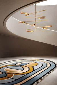 KLEOPATRA is a lounge rug inspired by ancient Egypt, not only for the chromatic choice but also for the linear and rigid graphics. This modern lounge version of the KLEOPATRA rug is a must-have tapestry with its sky blue and pale mustard tones and fringes.