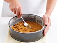Why you should use packaged rather than fresh cream cheese, how to make a biscuit crumb base, and what to do if your cheesecake cracks or shrinks.