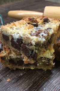 This is one of the best recipes for Hello Dolly Bars. The easy recipe includes coconut, chocolate chips, and sweetened condensed milk for a delicious dessert. #dessert #sweetenedcondensedmilk #condensedmilk #chocolatechips #chocolate #recipe #hellodollybars #bars #Christmas