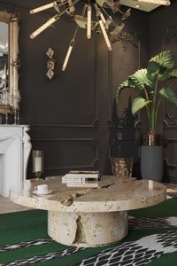 An all-black ambiance with marble details that fit perfectly with the Snake green rug and together, bring some life into the living room. A 100% handmade rug that combines the use of hand-tufted and overtufting techniques with different materials - natural wool and botanical silk.