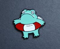 Cute Cartoon frog enamel pin. Affordable accessory for your backpack.