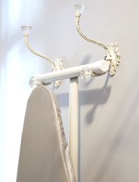Sewing room tip: use decorative hooks to store ironing board when not in use.