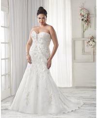 1600 - Sophisticated elegance best describes this wedding gown. Designed with the fuller figure in mind yet perfect for any size the flattering fit and flare silhouette is embellished with lavish beading. The modified sweetheart neckline is highlighted by a sheer inset. View our entire plus size bridal collection on our website.