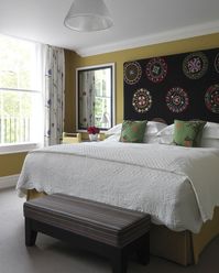 If you’re not very sure about using several colours at once, specially in large swathes on walls, you can introduce them in small doses. Take for instance the headboard at the Dorset Square Hotel. Image courtesy, Simon Brown for Dorset Square