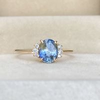 Main Stone is a 1.40ct Natural Bi Color Sapphire, it's shinning bright & sparkles. This ring really is one one of a kind ring witht he unique combination of blue & yellow mix of the sapphire, this shows off elegance & your unique taste. This is a great option for non diamond engagement ring .
