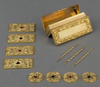 Gaming box, Alexander James Strachan (c. 1799-c. 1850) (goldsmith), hallmark 1825-6. Rectangular double hinged gold box, both lids with chased scroll and floral borders in high relief and central engine-turned panels. Top containing four rectangular and four circular pierced gold game counters.
