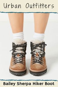 Extra cozy hiker boot by Urban Outfitters, featuring a unique faux fur tongue + collar front. Metal D-ring lace-up on a suede upper with contrast nylon overlays. Set on a treaded sole for extra traction in slippery winter weather. #urbanoutfitters #afflink #fashion