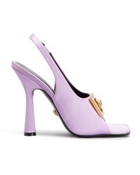 Versace satin chunky sandals with crystal embellished Medusa buckle accent 4.33 in / 110 mm stiletto heel Open square toe Wide band upper Stretch halter slingback Made in Italy | Versace Medusa Crystal Sandals