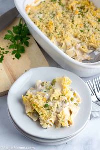 Tuna Noodle Casserole. An easy dinner casserole made with egg noodles, canned tuna, peas, and cream of mushroom soup that is easy to make and perfect for dinner.