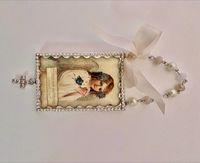 Beautiful Easter image, soldered, under beveled glass and surrounded by rhinestone chain. Ornament measures 2 x 3 inches.