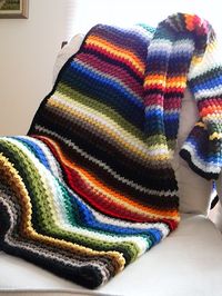 scrappy striped afghan- love all the colors in this one-slip stitch followed by a double crochet-repeat across, next row double crochet in the slip stitch and slip stitch in the double crochet.